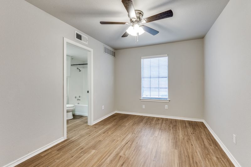Bright bedroom with vinyl plank flooring