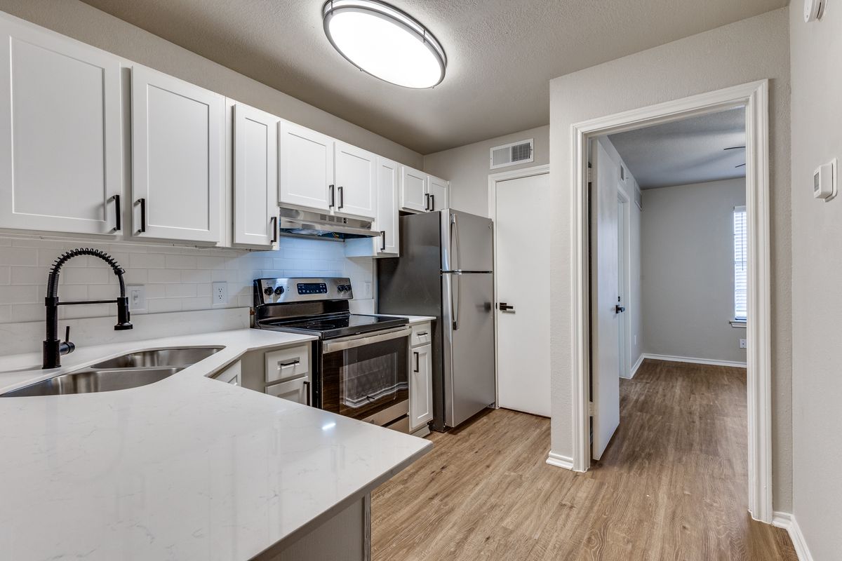 Renovated kitchen with quartz countertops at The Crest at River District